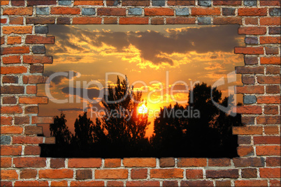 broken brick wall and view to the sunset