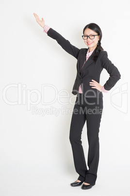 Asian business woman pointing