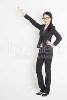 Asian business woman pointing