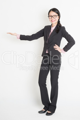 Asian business woman showing copy space