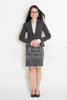 Full body Asian business woman