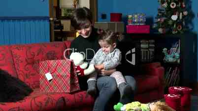 Happy Woman And Baby Girl Opening Present Gift For Christmas