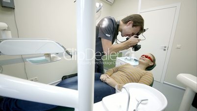 Dentist making photo of patients smile