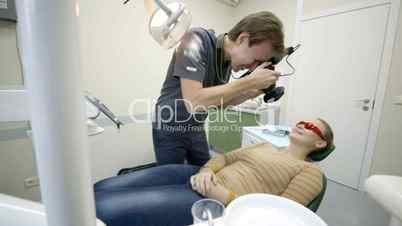 Dentist taking pictures of womans smile