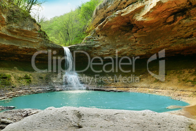 lake and waterfall in the forest