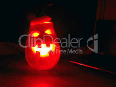 Cheerful red pumpkin at Halloween night