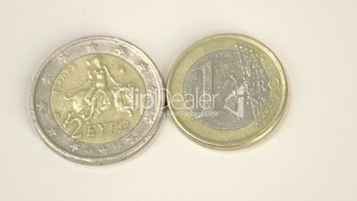 Two Greece Euro coins 2 Euro and 1 Euro on the table