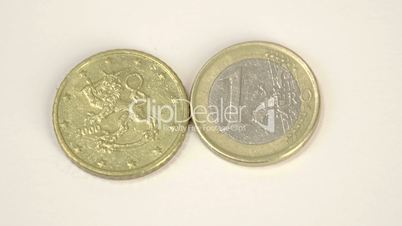 A 2000 version of a Finnish Euro coin and a 1 Euro coin