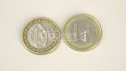 A harp image on a Ireland Euro coin and a 1 Euro coin