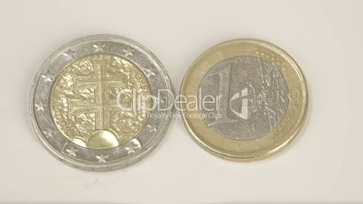 The back detail of the 2 Slovenian Euro coin and a Slovenia 1 Euro coin