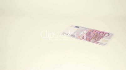 Five Euro bills thrown on the table