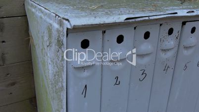A big mailbox with eight small holes