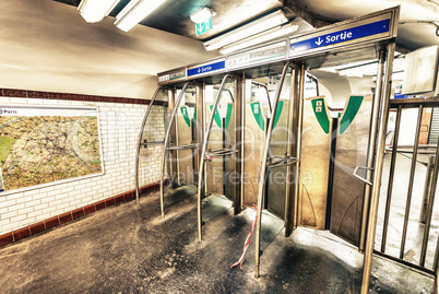 Entrance gates of Paris Metro. Subway interior view