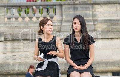 PARIS - JUNE 14, 2014: Unidentified asian tourist relaxes in Par