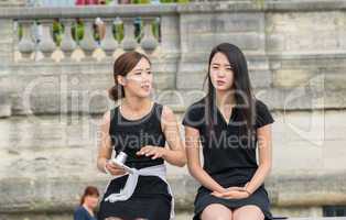 PARIS - JUNE 14, 2014: Unidentified asian tourist relaxes in Par