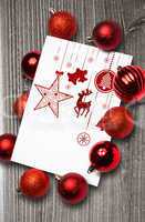 Composite image of hanging red christmas decorations