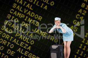 Composite image of pretty air hostess smiling at camera