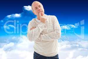 Composite image of thinking mature man with hand on chin