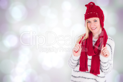 Composite image of festive blonde smiling at camera