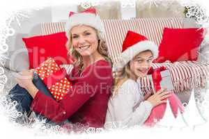 Composite image of festive mother and daughter smiling at camera