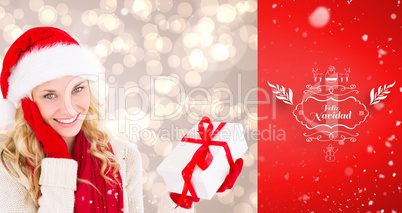 Composite image of happy festive blonde with gift