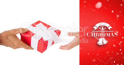 Composite image of couple passing a wrapped gift