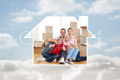 Composite image of cheerful family relaxing sitting on the floor