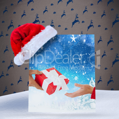 Composite image of couple holding gift