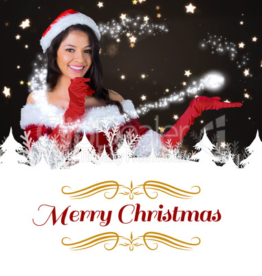 Composite image of pretty girl presenting in santa outfit