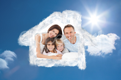 Composite image of lovely family sitting together on the bed