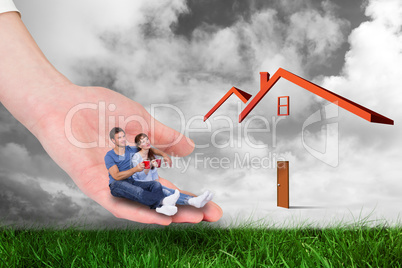 Composite image of hand holding couple