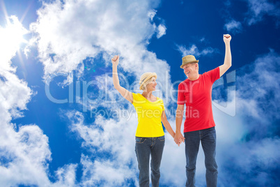 Composite image of mature couple walking and holding hands