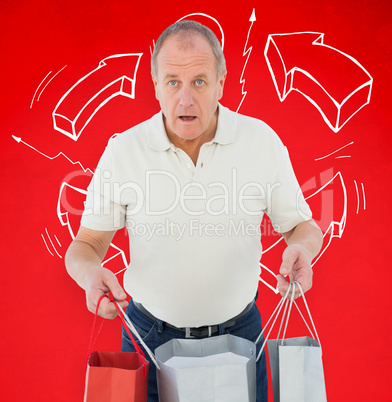 Composite image of shocked man holding shopping bags