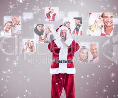 Composite image of santa is shocked to camera