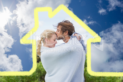 Composite image of cute affectionate couple standing outside wra