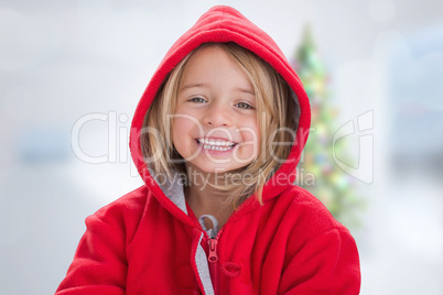 Composite image of cute girl in hooded jumper