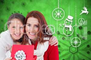 Composite image of mother and daughter with gift