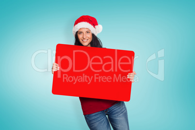Composite image of woman holding a sign