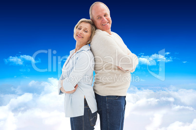 Composite image of mature couple standing and smiling at camera