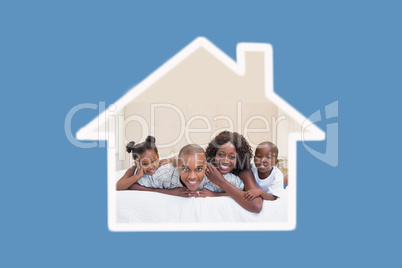 Composite image of happy family smiling at camera together on be