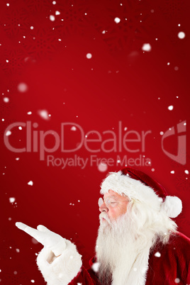 Composite image of santa claus blowing