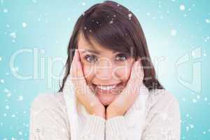 Composite image of brunette in winter clothes smiling at camera