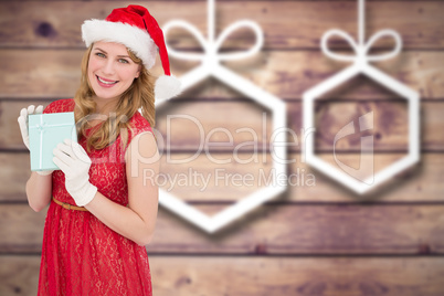 Composite image of smiling blonde in red dress wearing gloves an