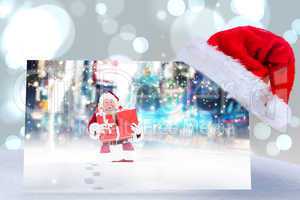 Composite image of santa hat on poster