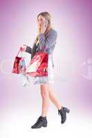 Stylish blonde holding shopping bags