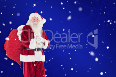 Composite image of santa carries his red bag