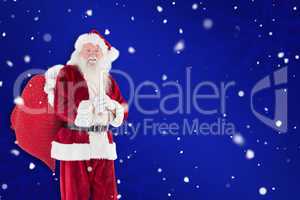 Composite image of santa carries his red bag