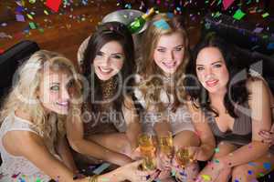 Composite image of pretty friends having a drink together