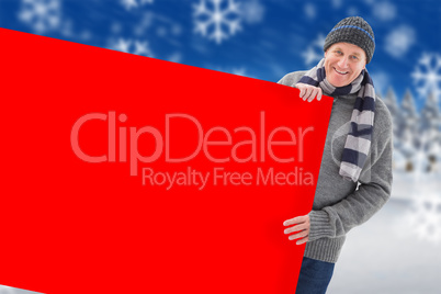 Composite image of winter couple showing poster