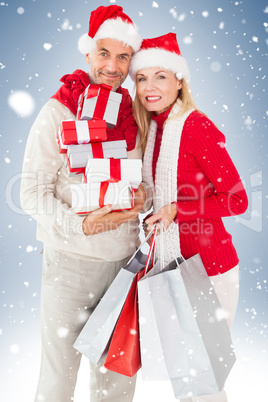 Happy festive couple with gifts and bags